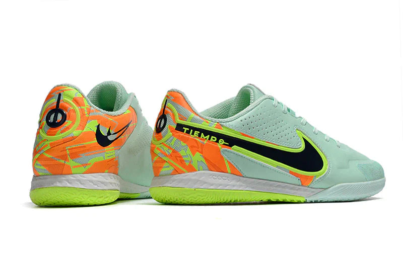 Chuteira Futsal Nike Tiempo Legend 9 Elite IC em cores vibrantes, ideal para performance no futsal.