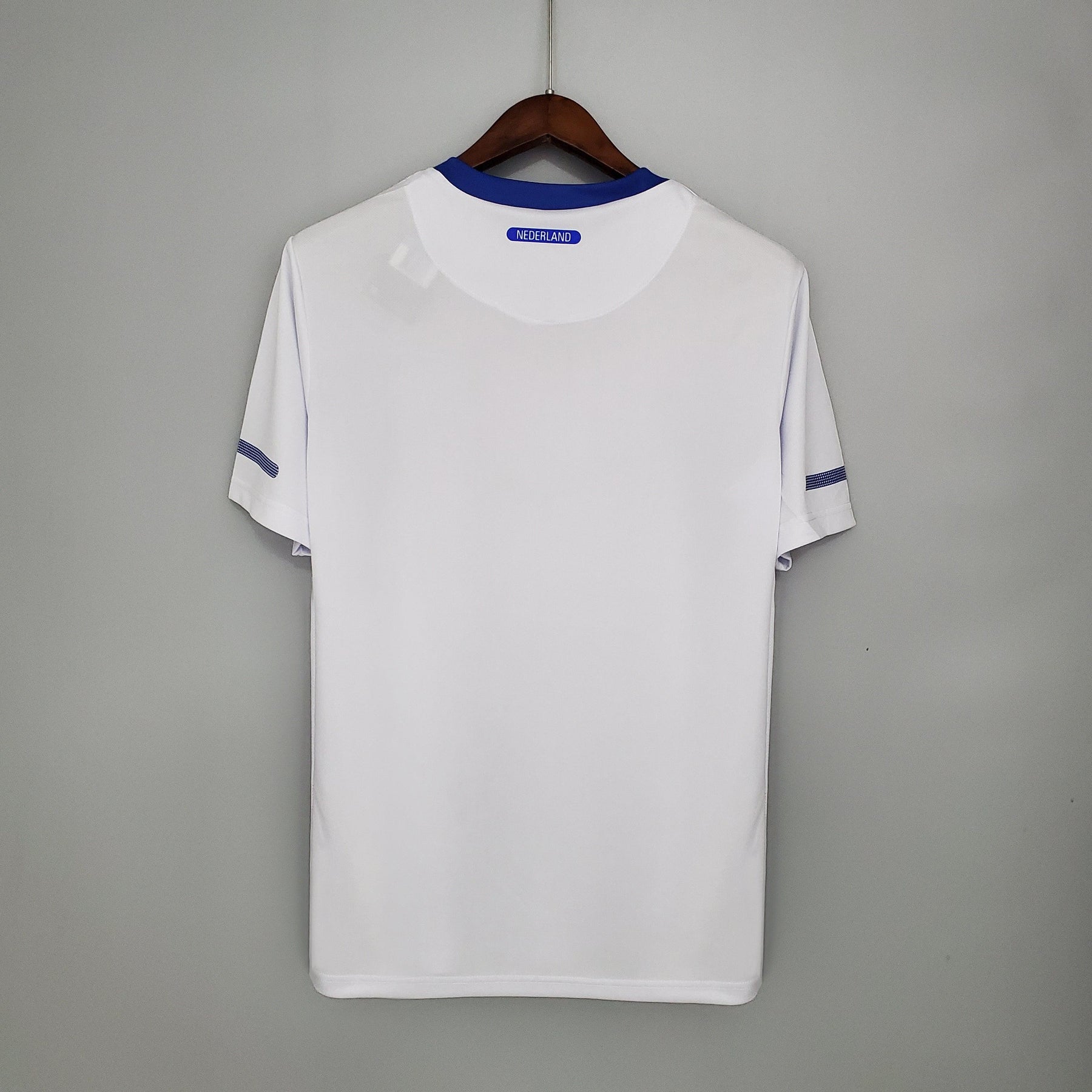 Camisola Holanda Away 12/13 Retro, vista traseira em fundo cinza, disponível na OLYMPIC STORE.