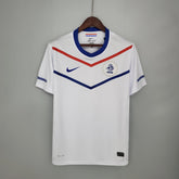 Camisola Holanda Away 12/13 Retro com design branco e detalhes em azul e vermelho da Nike.