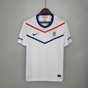 Camisola Holanda Away 12/13 Retro com design branco e detalhes em azul e vermelho da Nike.