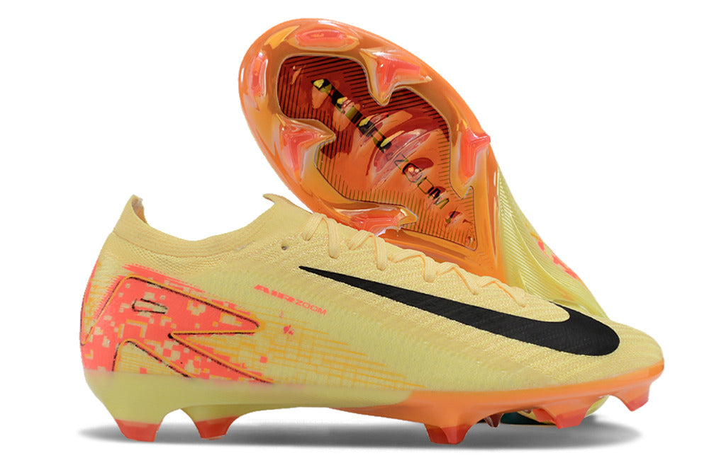 Chuteira Nike Mercurial Air Zoom Vapor 16 Elite FG Amarelo e Laranja em destaque, mostrando design e sola.