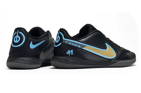 Chuteira Futsal Nike Tiempo Legend 9 Elite IC, modelo com design preto e detalhes em azul e dourado.