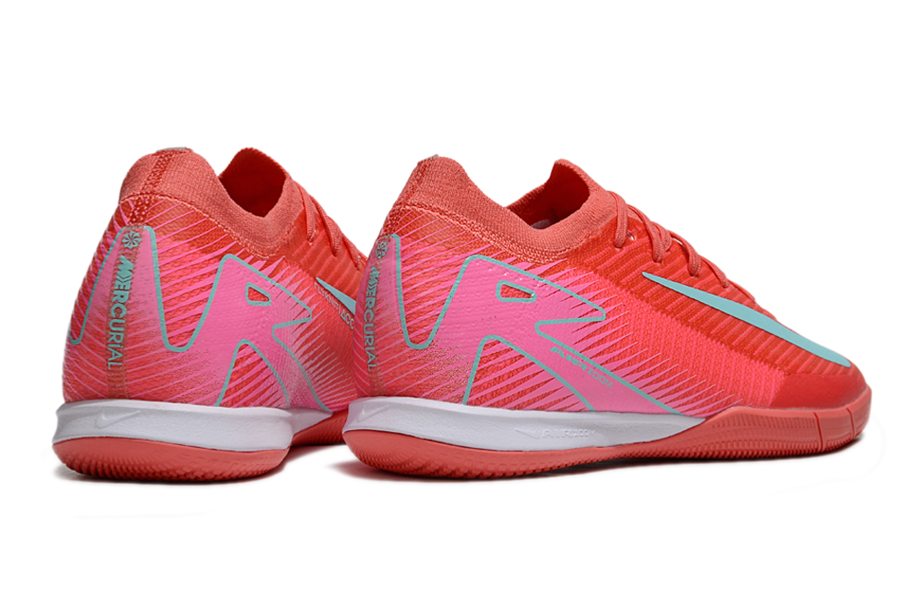 Chuteira Futsal Nike Mercurial Air Zoom Vapor 16 IC - Vermelha e Azul com design aerodinâmico e cores vibrantes.