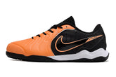 Chuteira Futsal Tiempo 10 Legend Elite IC Laranja e Preta lateral em fundo branco