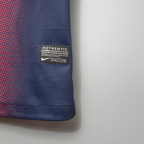 Detalhe da etiqueta autenticidade da camisa retro Barcelona Home 12/13, marca Nike.