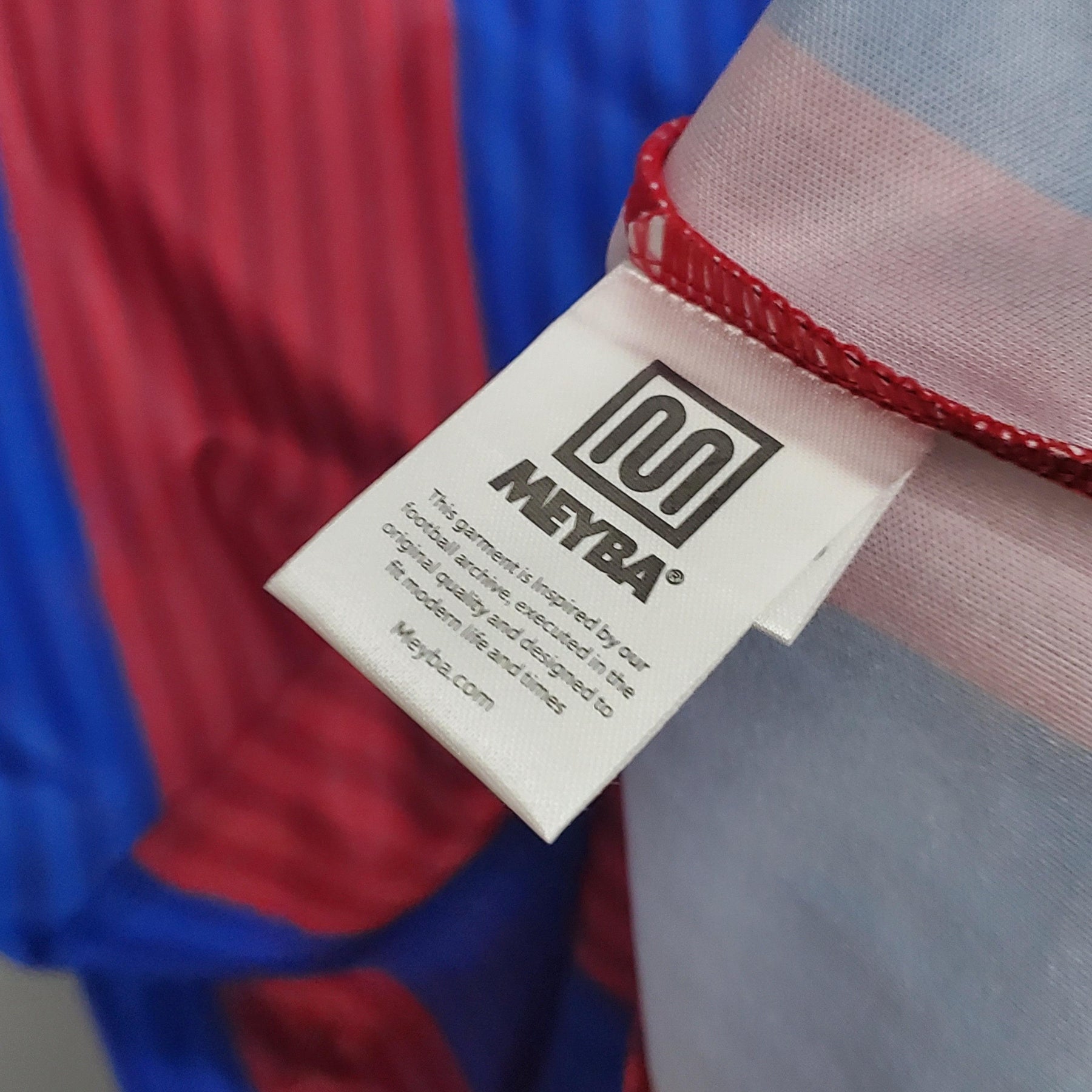 Etiqueta de produto mostrando logo METRA e informações sobre a Barcelona Home 90/91 Retro Olympic Store.