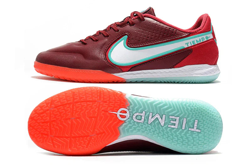 Chuteira Futsal Nike Tiempo Legend 9 Elite IC na cor vermelha, detalhes em verde e sola laranja.