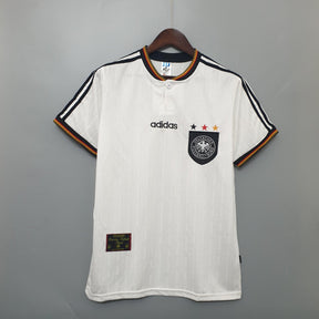 Camisola Alemanha Home 1996 Retro com detalhes da Adidas e logo da seleção, em branco e preto.