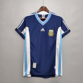 Camisola Argentina Away 98/99 Retro com detalhes em azul e branco, logo da AFA e marca Adidas