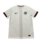 Camisola Chelsea Away 2025/26 Off White com detalhes em preto e vermelho, fabricada pela Nike.