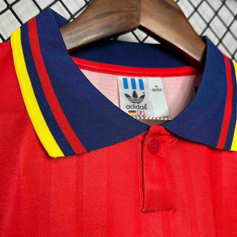 Camisola Espanha GK 1994 Retro com gola azul e detalhes amarelos e vermelhos.