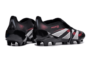 Chuteira Adidas 25 Predator Elite Tongue FG em design preto e vermelho, ideal para desempenho em campo.