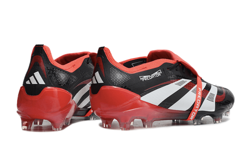 Chuteira Adidas 25 Predator Elite Tongue FG em preto e vermelho, ideal para desempenho em gramados naturais.
