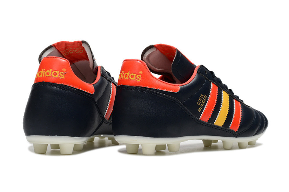 Chuteira Adidas Copa Mundial FG Preta, Vermelha e Amarela com design tricolor vibrante e sola para gramados naturais.