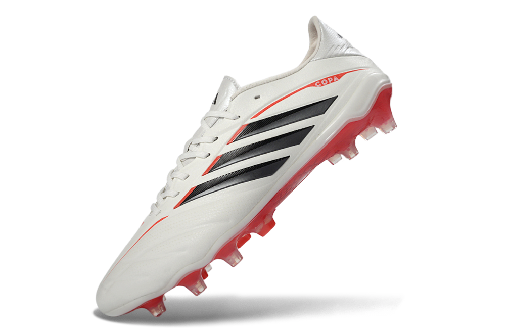 Chuteira Adidas Copa Pure IV Elite FG - Born For Goals Pack em branco com detalhes em vermelho e preto.
