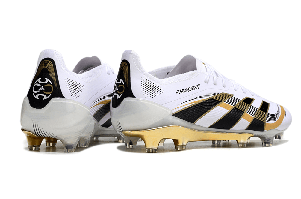 Chuteira Adidas Predator Elite FG - Branca e Dourada "Teamgeist" com detalhes em preto e dourado.