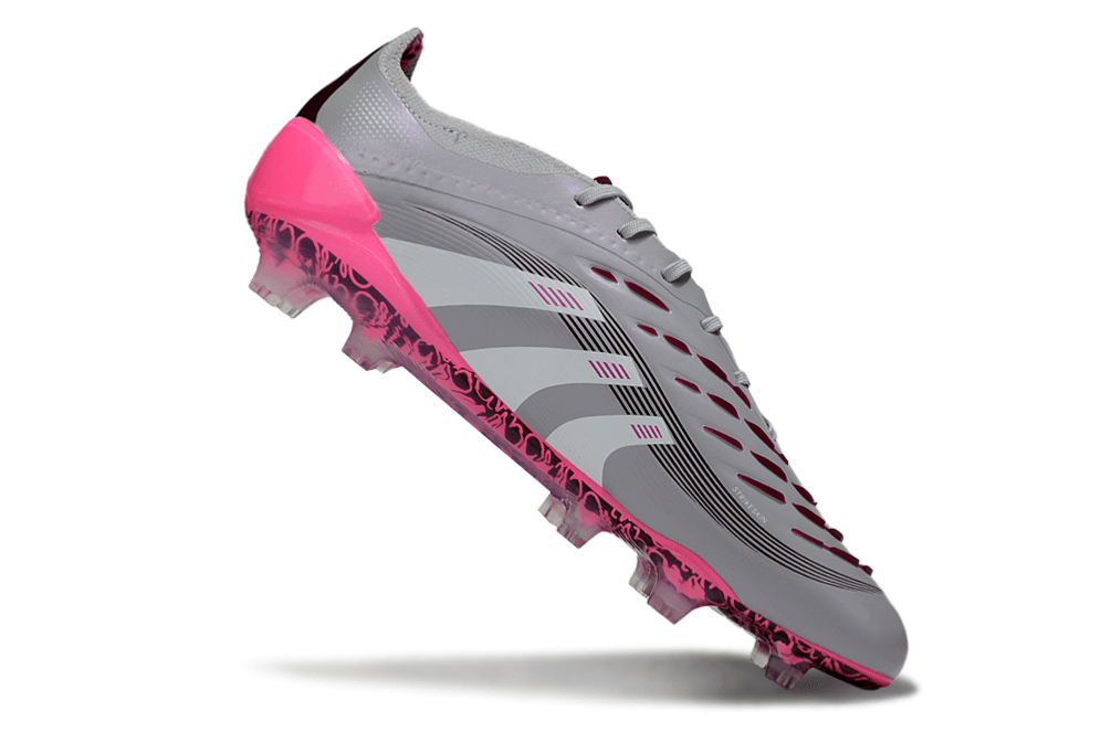 Chuteira Adidas Predator Elite FG - Rosa Ed. "Bellingham" em ação, destacando design e cores vibrantes.