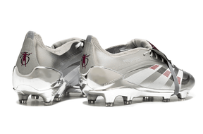 Chuteira Adidas Predator Elite FG Tongue Prateada Ed. "Bellingham" com design prateado e detalhes em vermelho.