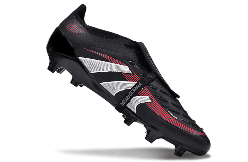 Chuteira Adidas 25 Predator Elite Tongue FG em preto e vermelho, ideal para desempenho em campo.