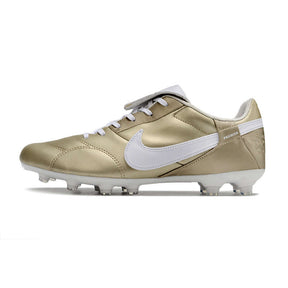 Chuteira Campo Nike Premier 3 FG Dourada em acabamento dourado com detalhes em branco.