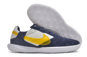 Chuteira Futsal Nike Street Gato IC - Branca, Azul e Amarela, ideal para futsal com sola IC para máxima aderência.