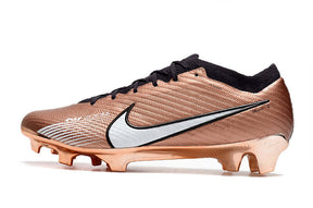 Chuteira Nike Air Zoom Mercurial Vapor 15 Elite FG na cor cobre, com design aerodinâmico e tecnologia de amortecimento.