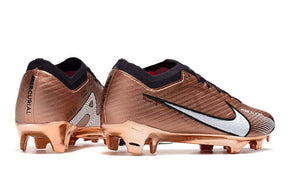 Chuteira Nike Air Zoom Mercurial Vapor 15 Elite FG em cor bronze e detalhes em preto.