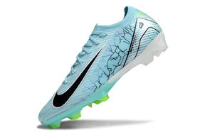 Chuteira Nike Air Zoom Mercurial Vapor 16 Elite FG - Azul e Verde, com design aerodinâmico e tecnologia avançada.
