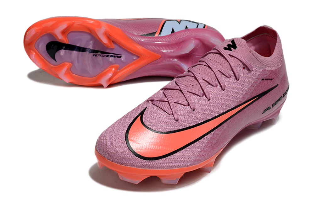 Chuteira Nike Air Zoom Mercurial Vapor 16 Elite FG - Rosa - Pack Scary Good com detalhes vibrantes e sola laranja destacada.