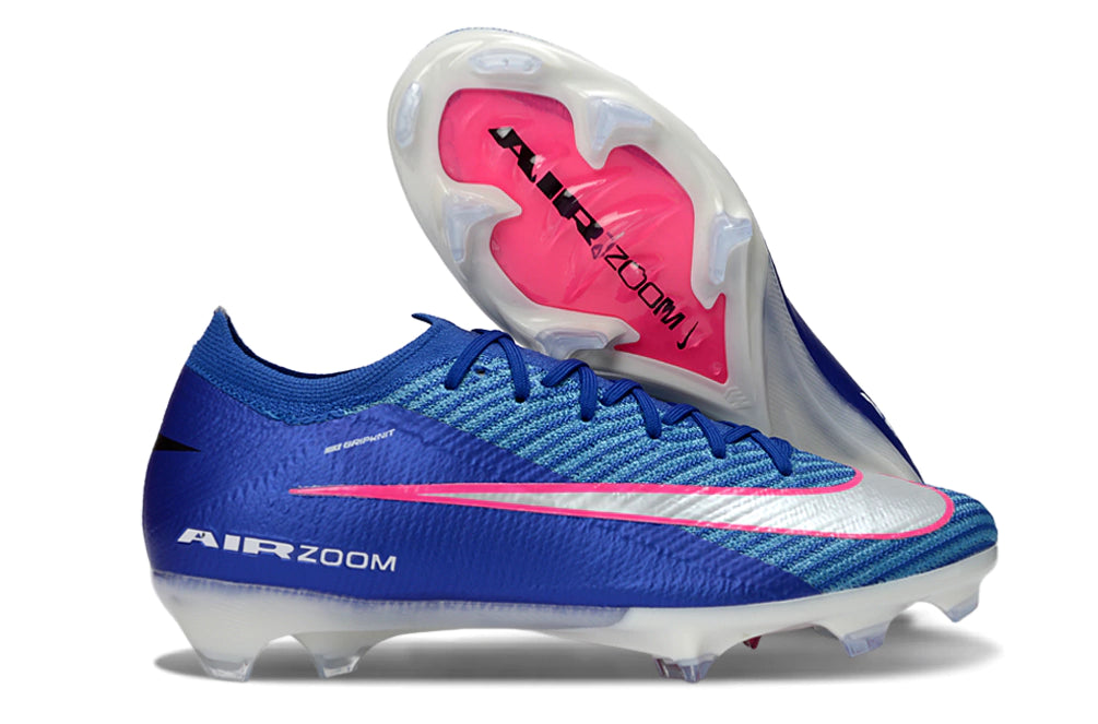 Chuteira Nike Mercurial Vapor 16 Elite FG Azul Attack Pack em azul intenso com detalhes em rosa.