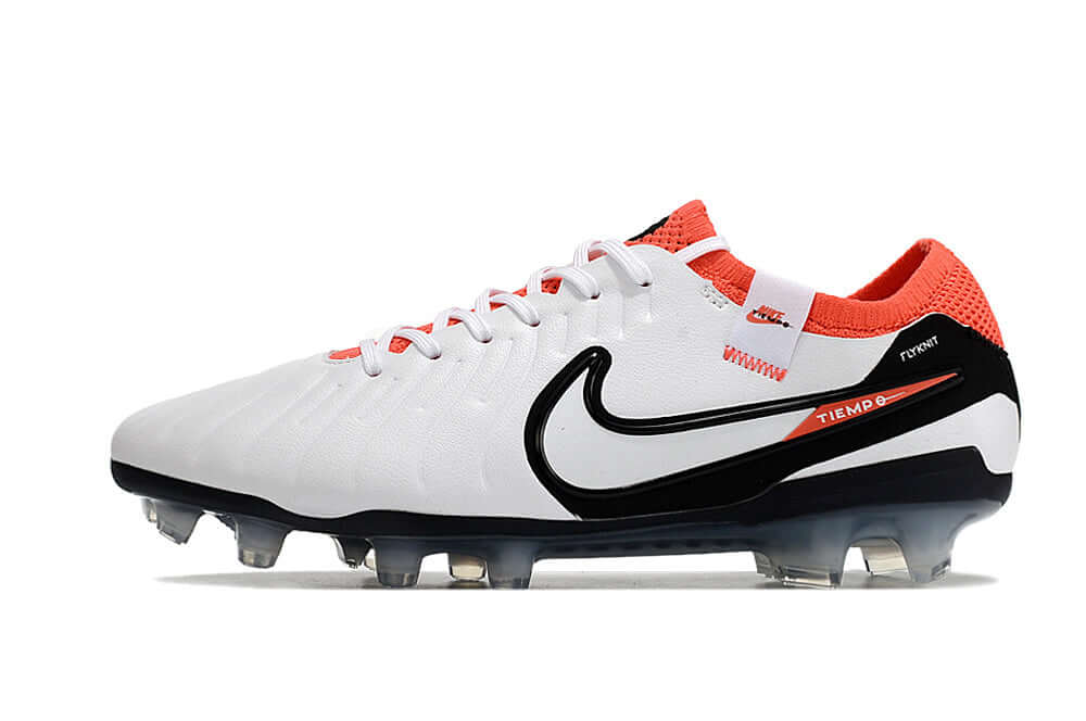 Chuteira Nike Tiempo Legend 10 FG - Branca, Vermelha e Preta em vista lateral, destacando design e tecnologia inovadora.