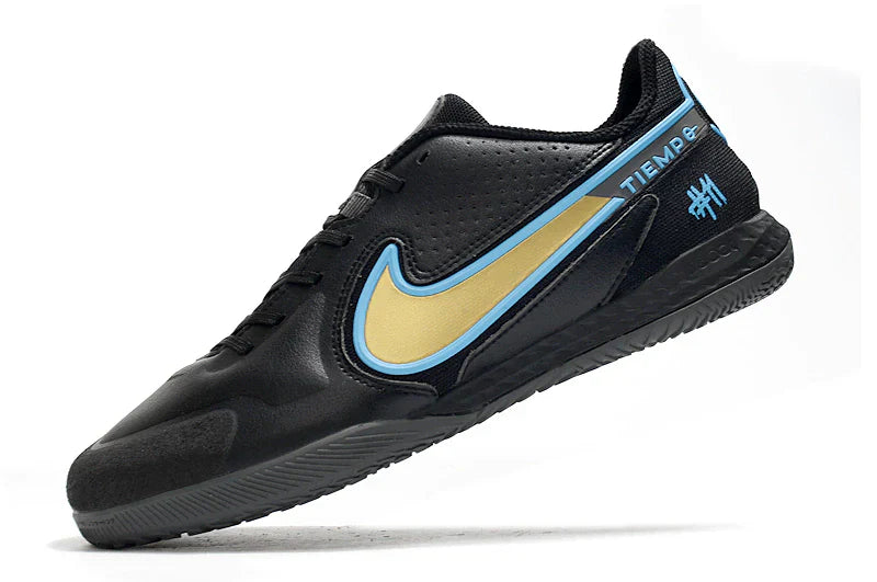 Chuteira Futsal Nike Tiempo Legend 9 Elite IC em preto e dourado, ideal para performance em quadras.