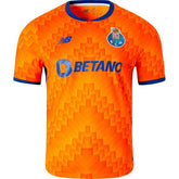 Camisola FC Porto away 24/25 Laranja com detalhes em azul e logo da Betano, coleção OLYMPIC STORE.