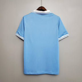 Camisolas Napoli Home 86/87 Retro vista traseira em azul com detalhes em branco, ideal para fãs de futebol.