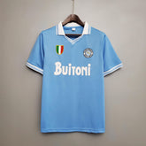 Camisolas Napoli Home 86/87 Retro na cor azul, com detalhes em branco e logo Buitoni.