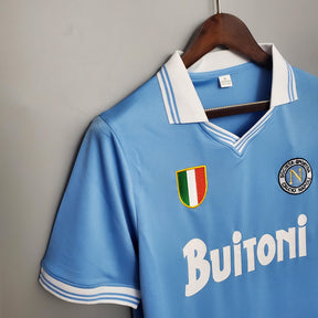 Camisolas Napoli em estilo retrô, camisa de futebol azul com detalhes brancos e logotipo Buitoni.
