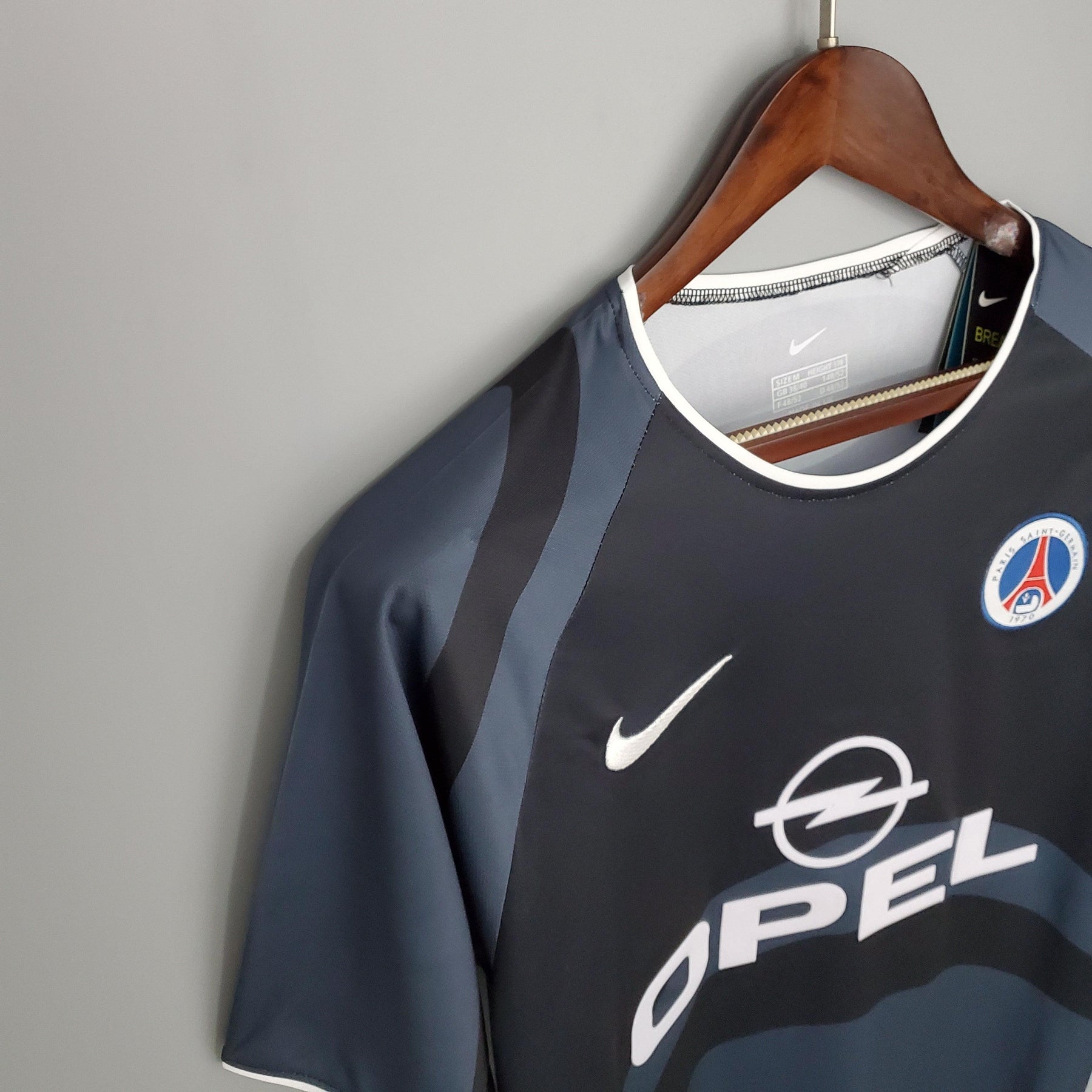 Camiseta PSG Away 01/02 Retro Azul Olympic com detalhes em cinza e logo da Opel