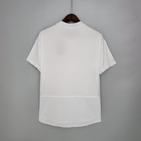 Camisa PSG Away 02/03 Retro na cor branca, vista traseira, ideal para torcedores e colecionadores.